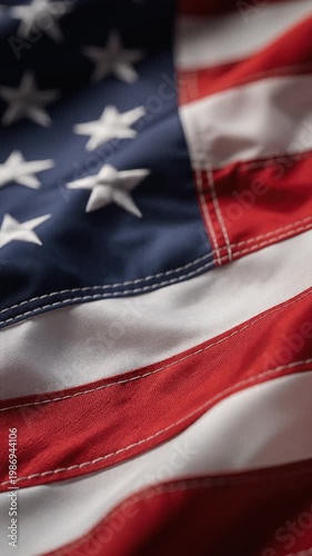Close up of American flag waving in the wind showcasing stars and stripes patriotic symbol