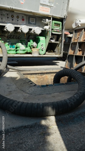 Refueling pipes from truck for a gas station tank during petrol shortage crisis