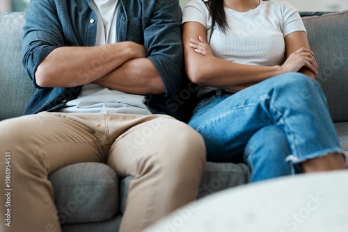 Obraz na plátne Frustrated, couple or fight with arms crossed in home on sofa for conflict, argument or dispute