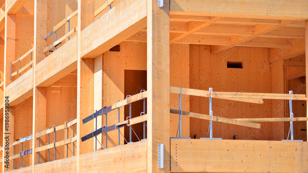 Naklejka premium Laminate wood floors and supports of a mass timber multi story green, sustainable office building construction project