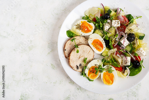 Healthy Salad with Boiled Eggs and Vegetables on White Background. Top view