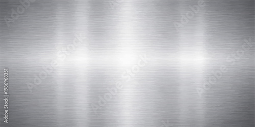A polished stainless steel plate featuring a brushed metal texture on a shiny silver aluminum surface with gray industrial reflections and a metallic pattern for an elegant grey backdrop
