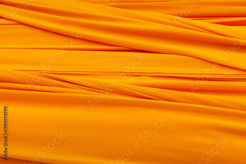 Photos Buddhist yellow cloth with intricate folds