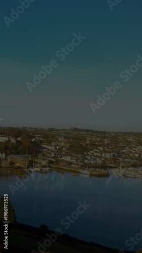 Vertical video: Science overlay starting above coastal harbor, formulas rising, drifting over sea