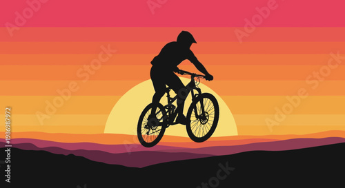 Mountain Biker Silhouette Against Vibrant Sunset Sky