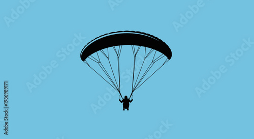 Paraglider Silhouette Floating Gracefully Against a Vibrant Blue Sky