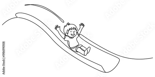 A happy young boy enjoys sliding down a playground slide with his hands raised in the air
