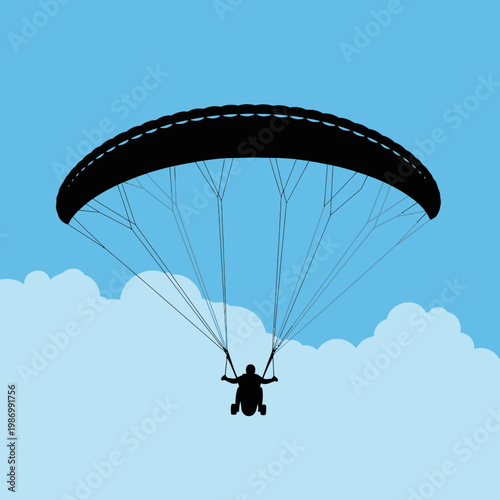 Paragliding Silhouette Against A Bright Sky With Clouds