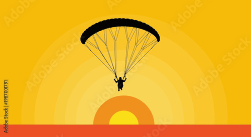 Silhouette Of A Paraglider Against A Warm Sunset Sky