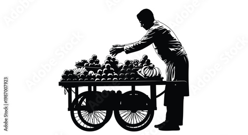 Man arranging fruit on a cart with various produce displayed