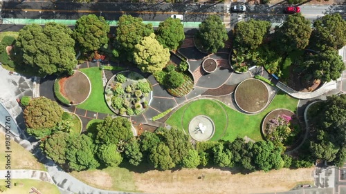 Ariel view of the lush green landscape and modern architecture of the Marine Parade, Napier, Hawkes Bay, New Zealand, showcasing its vibrant urban park.