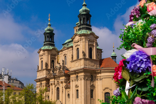 St. Nicholas Church architecture with flowers in Prague Old Town