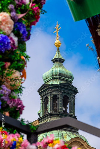 St. Nicholas Church architecture with flowers in Prague Old Town