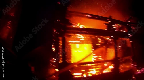 Firefighter rescuer navigating through intense flames and smoke, showcasing the urgency of rescue efforts, with dynamic camera movement capturing the heat and chaos of the scene