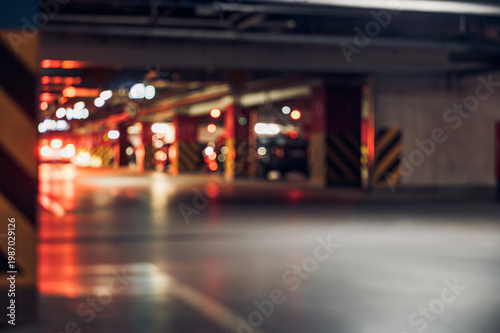 Bild auf Leinwand View of an underground parking area with blurred lights and vehicles, showing bu