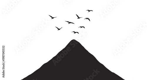 Silhouette of mountain with flying birds.
