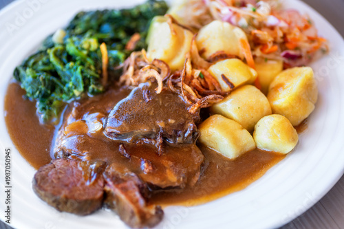 Wallpaper Mural Baked lamb meat in spicy souce, stewed spinach, roasted potato cube and salad on white plate Torontodigital.ca