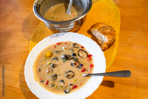 Wallpaper Mural Mushroom soup in asian style with coconut milk, flowers and chilli in white plate, pot and part of bun. Torontodigital.ca