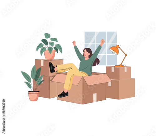Happy woman sitting in a cardboard box surrounded by moving boxes and houseplants