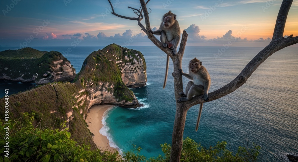 Fototapeta premium Monkeys perched on a tree branch overlooking a tropical beach at sunset.