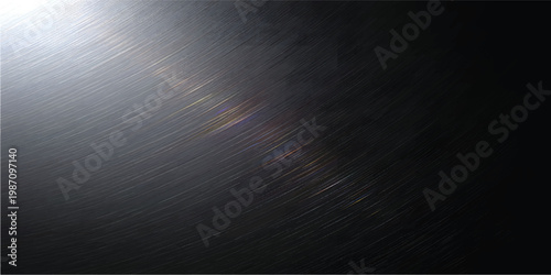 A shiny brushed silver metallic plate textured with light rays creates an abstract aluminum background featuring a dark grey stainless steel surface pattern