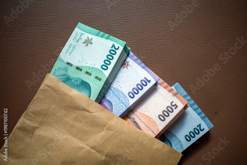Close up of money, Indonesian rupiah currency, banknote on a brown background