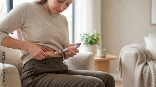 Woman injecting medication into abdomen at home, weight loss treatment concept, glp 1 therapy, healthcare lifestyle.