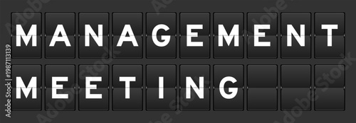 Black color analog flip board with word management meeting on gray background