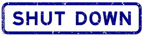 Grunge blue shut down word rubber square seal stamp on white background