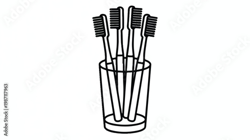 toothbrushes in a glass holder on white background