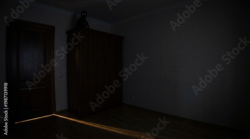 Dark bedroom with monster sitting on wooden wardrobe. Shadowy creature with glowing eyes watching from furniture. Scary night atmosphere in house with light coming from under door.