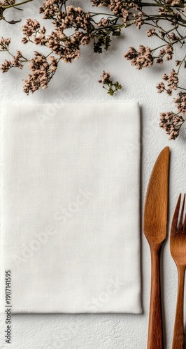 Elegant Table Setting with Floral Accents and Neutral Linen.