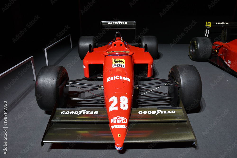 Fototapeta premium Scarperia; Italy - October 24th 2025: Ferrari F1-87 ex Michele Alboreto and Gerhard Berger on display during Ferrari World Finals 2025 at Mugello Circuit in Italy.