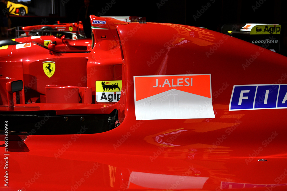 Fototapeta premium Scarperia; Italy - October 24th 2025: Detail of Ferrari 642 or F1-91 ex Alain Prost and Jean Alesi on display during Ferrari World Finals 2025 at Mugello Circuit in Italy.
