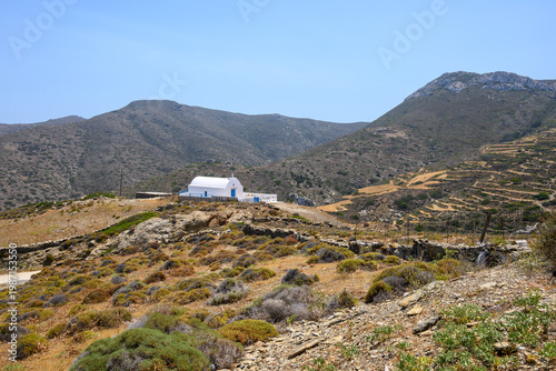 A Greek chapel seen from Moundoulia Hill, above the port of Katapola. Amorgos Island, Cyclades, Greece
