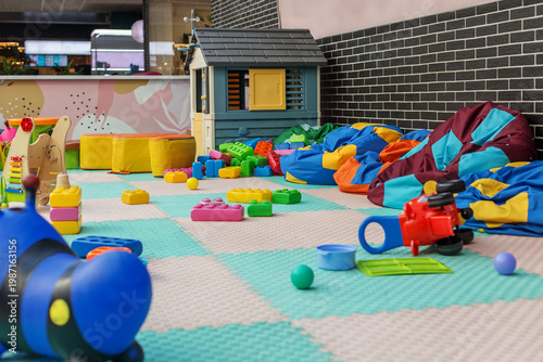 Colorful daycare playroom with toys and soft play equipment