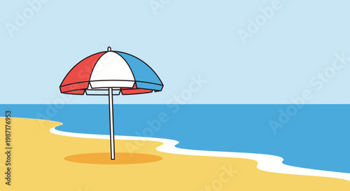 Beach umbrella on sandy shoreline with ocean and clear blue sky