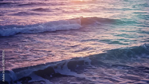 Ocean Waves Reflecting Sunset Colors in Purple and Teal Hues.