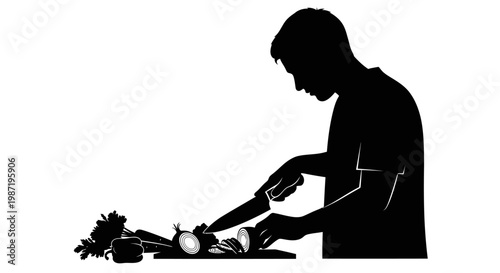 Man cutting vegetables on countertop.