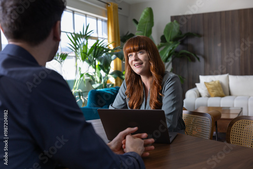 Businesswoman speaking in a meeting in a modern workplace