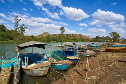 Traditional blue passenger boats moored on the Blue Nile river bank in Ethiopia