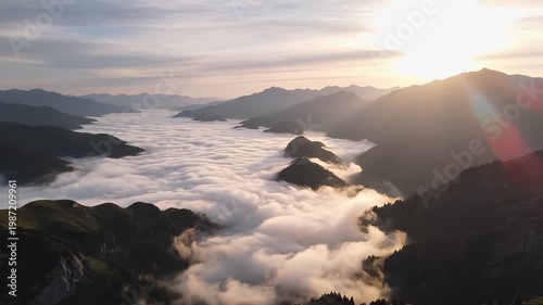 Spectacular golden sunrise over misty mountain valley and peaks