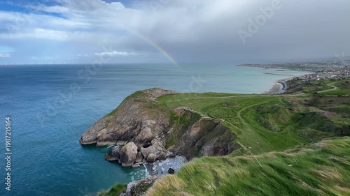 Little Orme Cliffs and Angel Bay with Rainbow over the Irish Sea, Llandudno, Conwy, Wales, UK