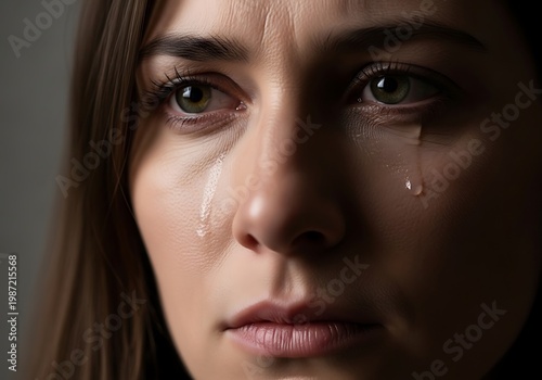 Intense Close Up of Woman with Tear on Cheek