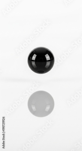 Black Glossy Sphere 3D Render on White Background with Reflection and Copy Space for Minimalist Design