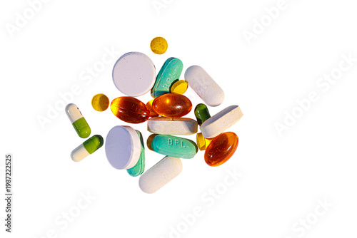 Assorted pharmaceutical pills and capsules scattered against a stark black background showcasing various colors high-qualit.png