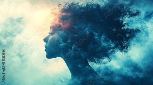 The silhouette of a dreamy young woman against a backdrop of blue clouds conveys a sense of inner harmony and serves as a decorative backdrop for psychological material on self-perception.