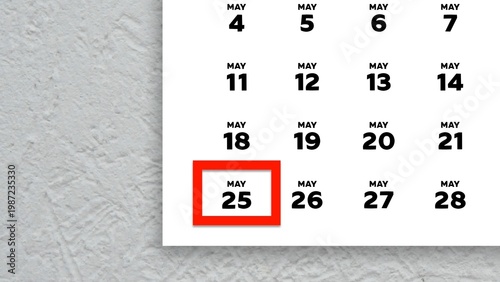 Close-up of the date May 25th marked with a red cursor on the wall calendar 2026