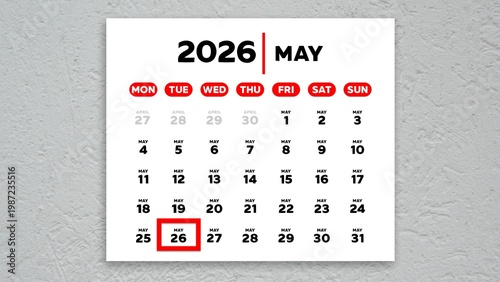 The date May 26th marked with a red cursor on a wall calendar 2026