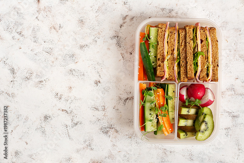Balanced diet meal prep with sandwich and healthy snacks